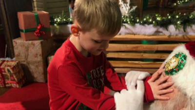 Santa helps blind child experience the magic of Christmas