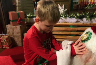 Santa helps blind child experience the magic of Christmas